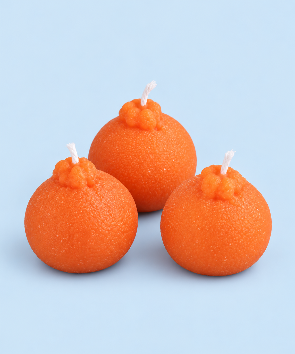 Bright orange mandarin-shaped beeswax candle from Market Mama