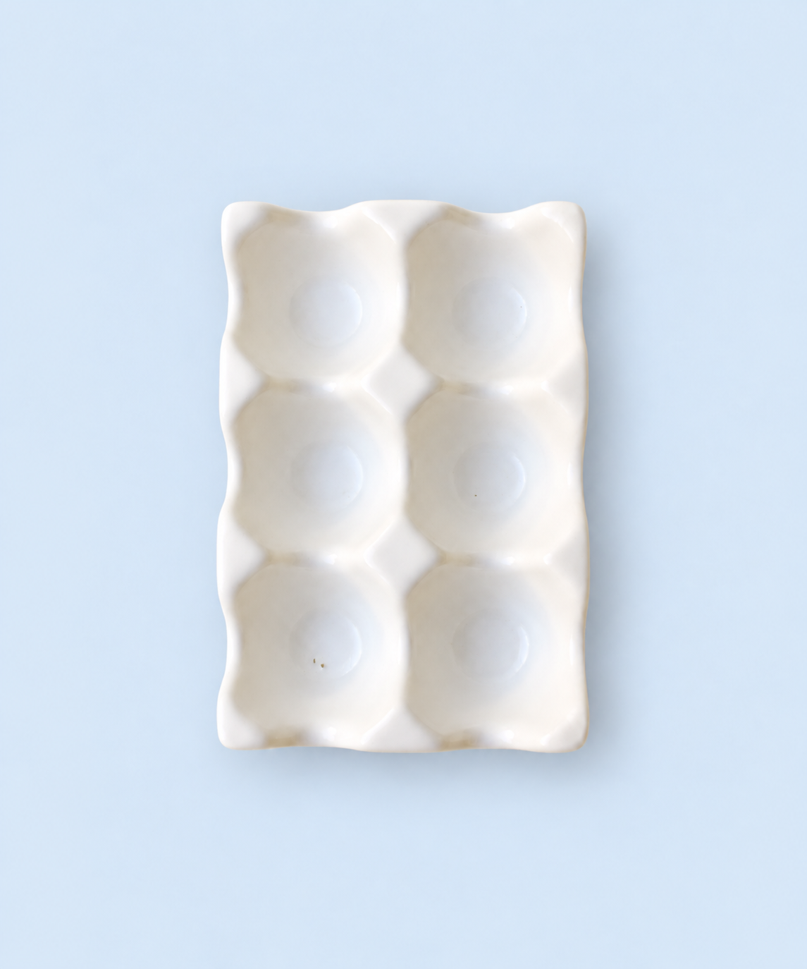 White glazed ceramic countertop egg tray for a half dozen eggs